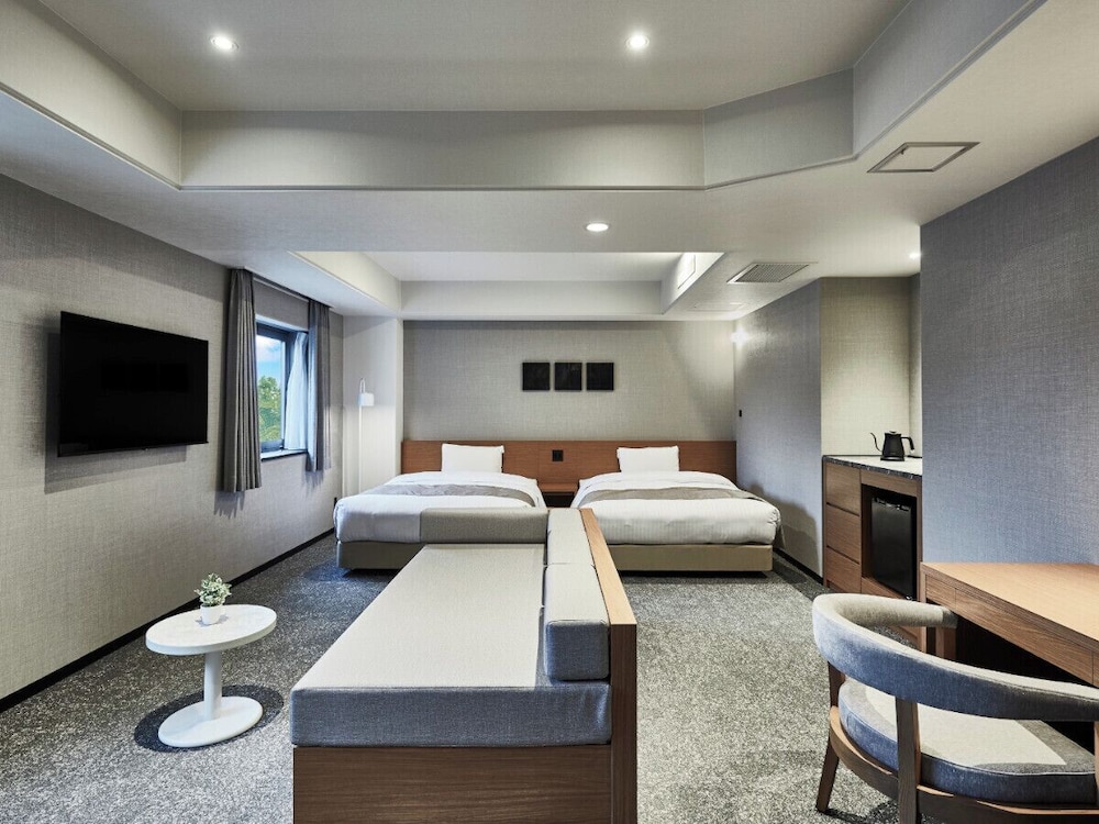 デラックスツイン (2ダブルベッド) 2～5名 禁煙 客室1 | ワン・ステーションホテル熊本