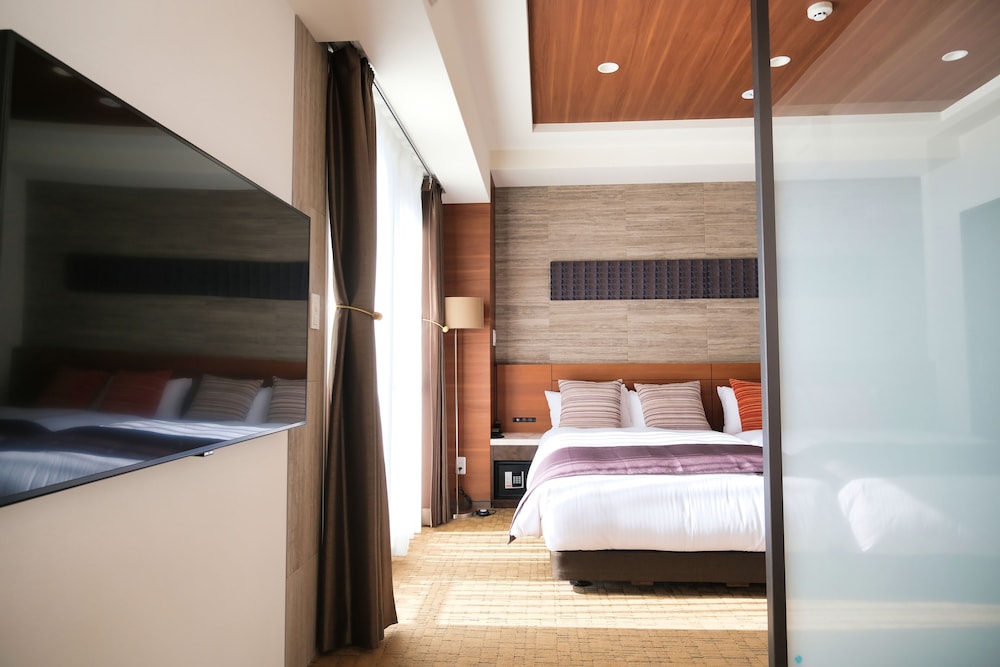 デラックス ツインルーム (38sqm) | ラクスケアホテル