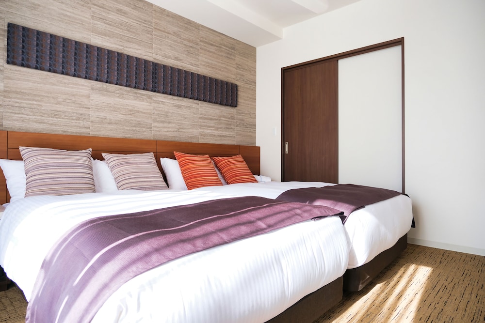 デラックス ツインルーム (38sqm) 客室2 | ラクスケアホテル