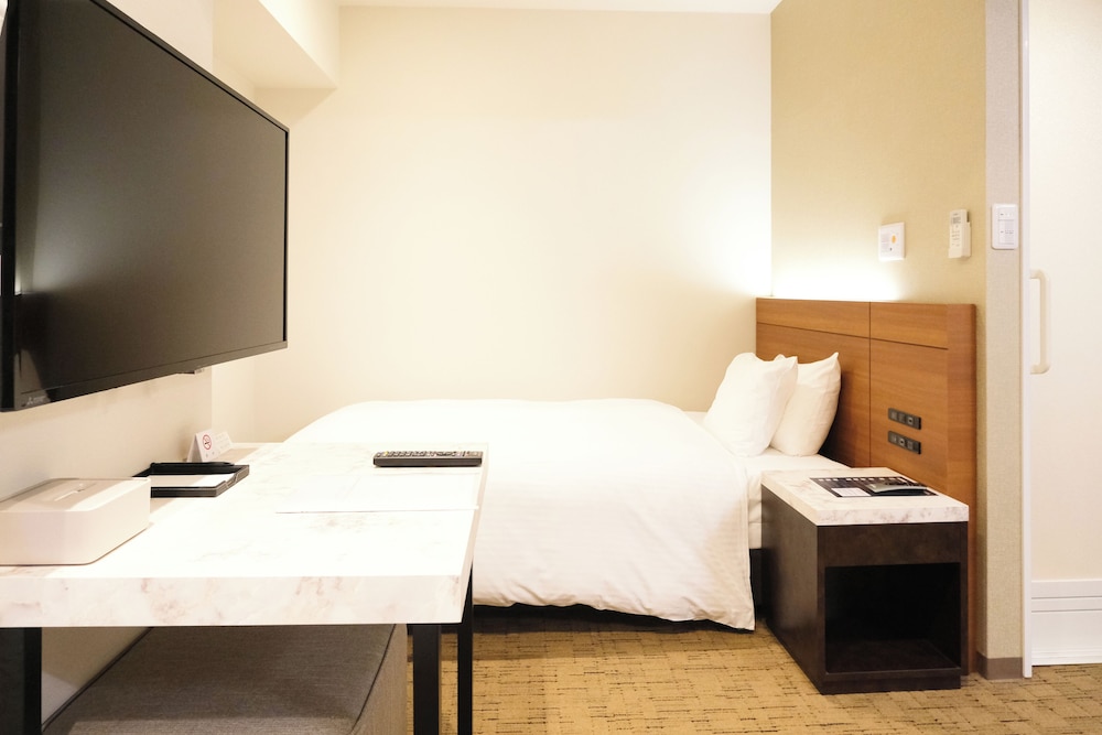 ユニバーサルツインルーム(21sqm) 客室1 | ラクスケアホテル