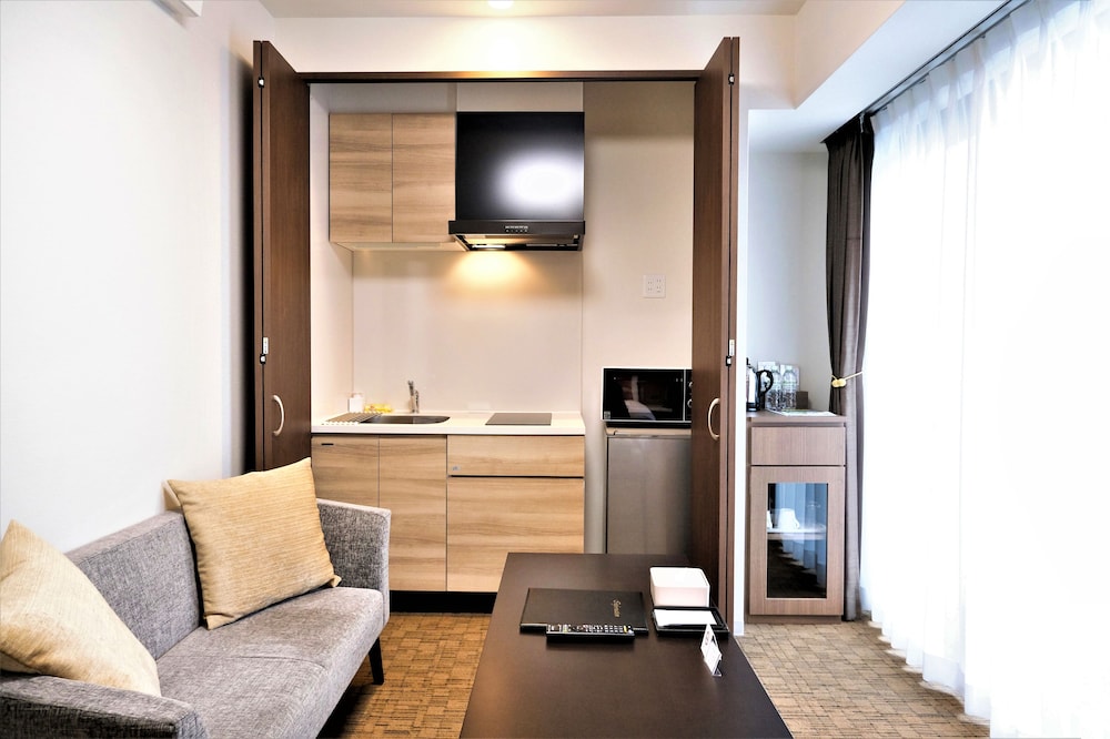 デラックス ツインルーム (38sqm) リビング エリア0 | ラクスケアホテル