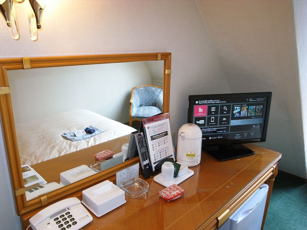 ツインルームシングルサイズベッド 2 台禁煙 客室1 | ホテル機山館