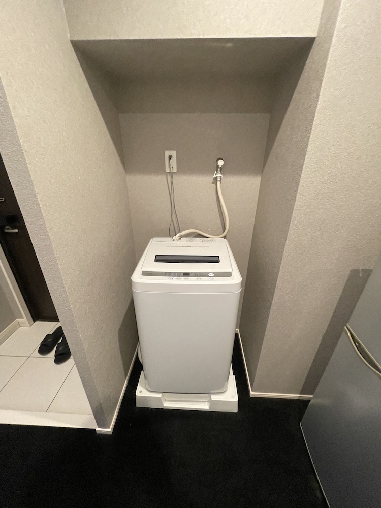 デラックス ツインルーム ランドリー1 | The Grand Residence Hotel Tenjin