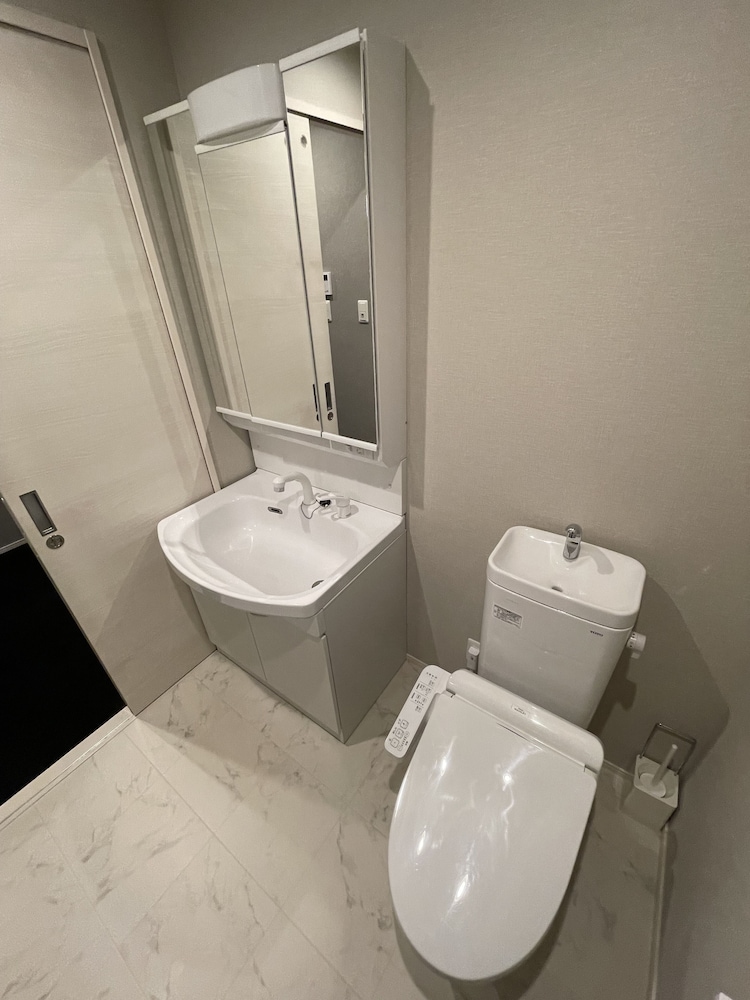 デラックス ツインルーム バスルーム1 | The Grand Residence Hotel Tenjin