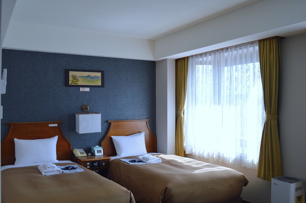 デラックス ツインルーム 禁煙 リビング エリア0 | ホテルニューステーション