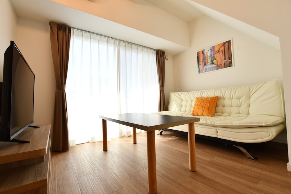 デラックス アパートメント リビング エリア5 | Riverside Inn Hakata