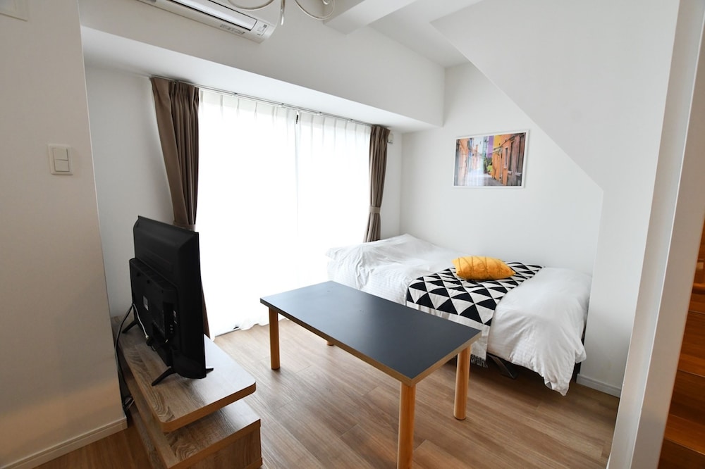 デラックス アパートメント リビング エリア1 | Riverside Inn Hakata