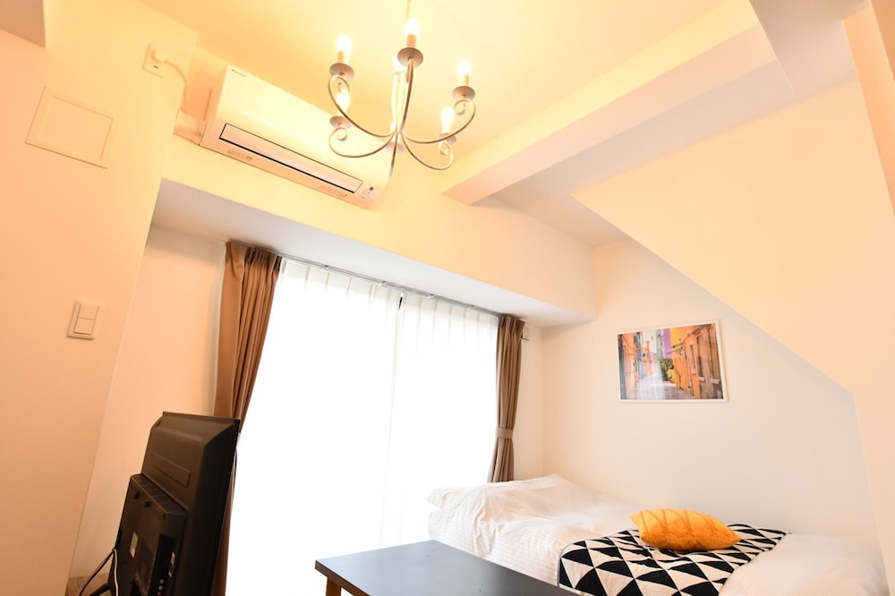 デラックス アパートメント リビング エリア2 | Riverside Inn Hakata