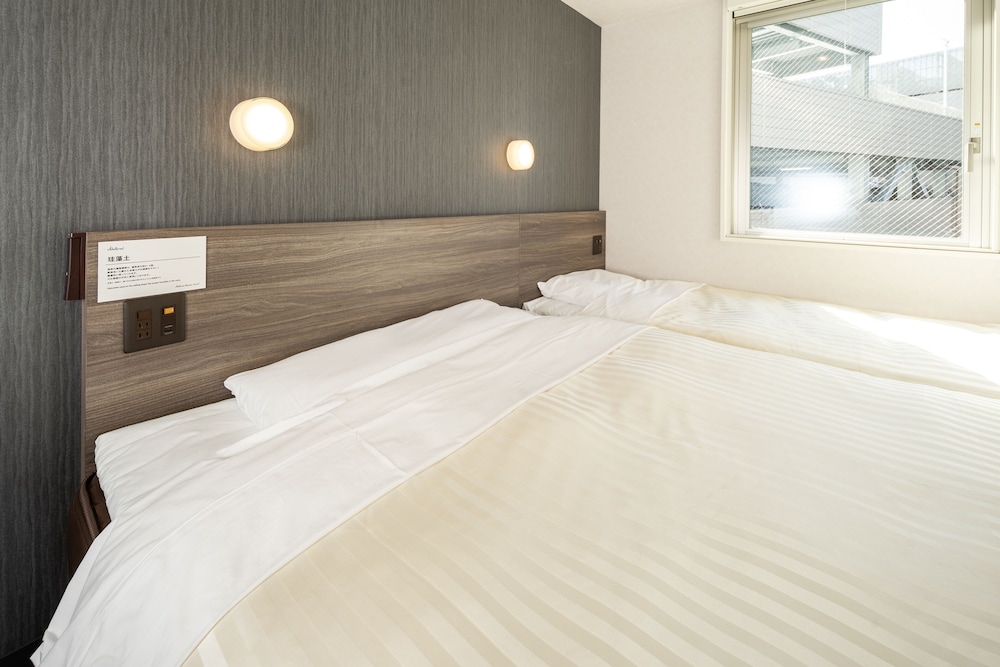 ハリウッドツインルーム 禁煙 客室2 | スーパーホテル広島天然温泉・薬研堀通り