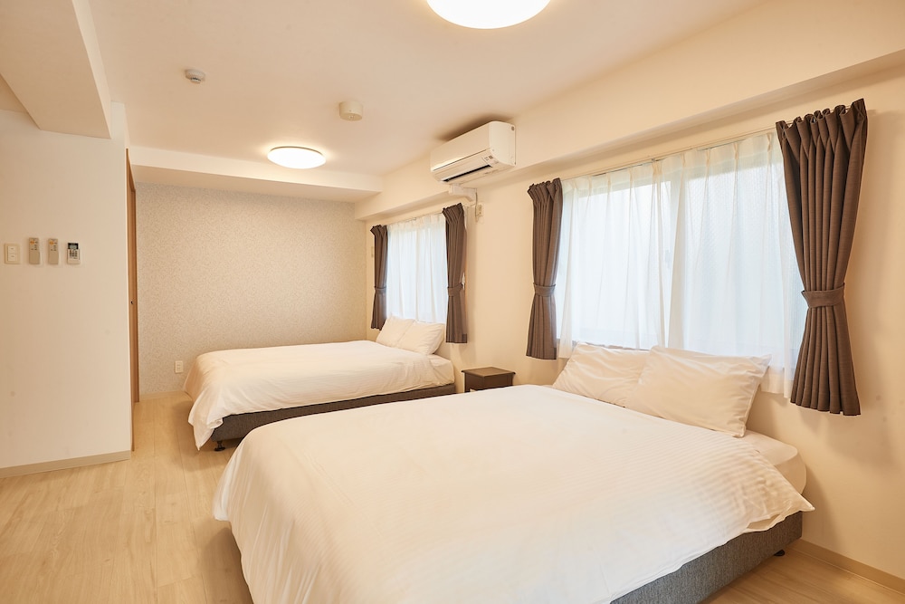 デラックス ルーム 1 ベッドルーム テラス 客室1 | New Normal Hotel in NAGO