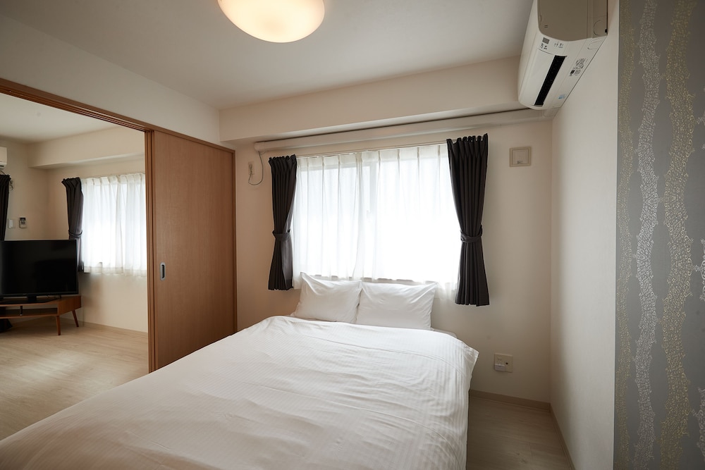 デラックス ルーム 2 ベッドルーム 客室1 | New Normal Hotel in NAGO