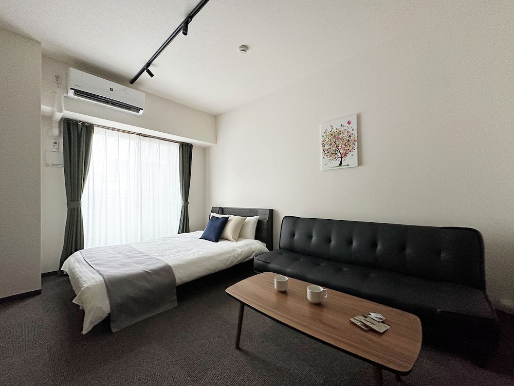 シティ スタジオ ダブルベッド 1 台ソファーベッド付き 客室1 | NAGOMI