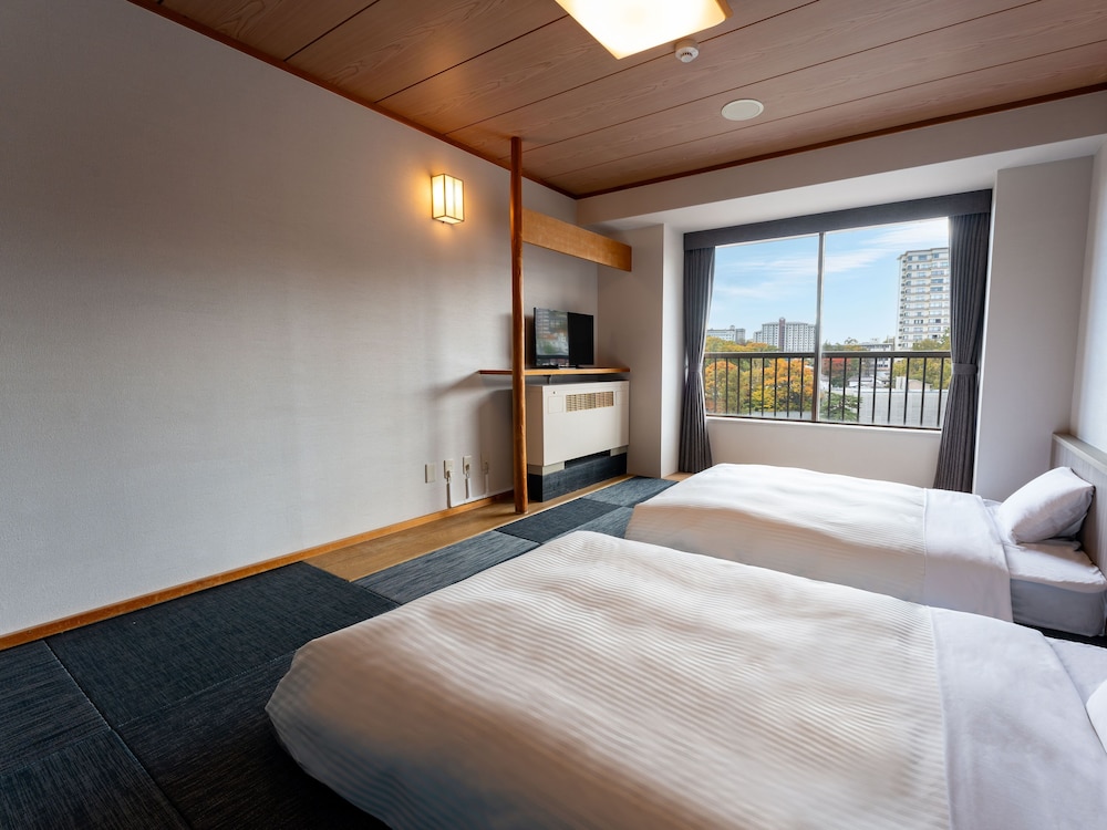 デラックス和室ツイン10畳 禁煙 客室2 | 亀の井ホテル 草津湯畑