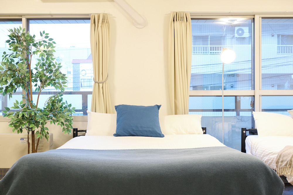 デラックス アパートメント リビング エリア3 | Residence Hotel KABUTO
