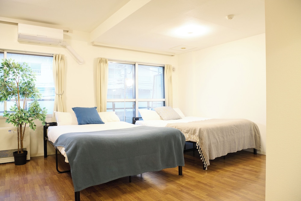 デラックス アパートメント リビング エリア1 | Residence Hotel KABUTO