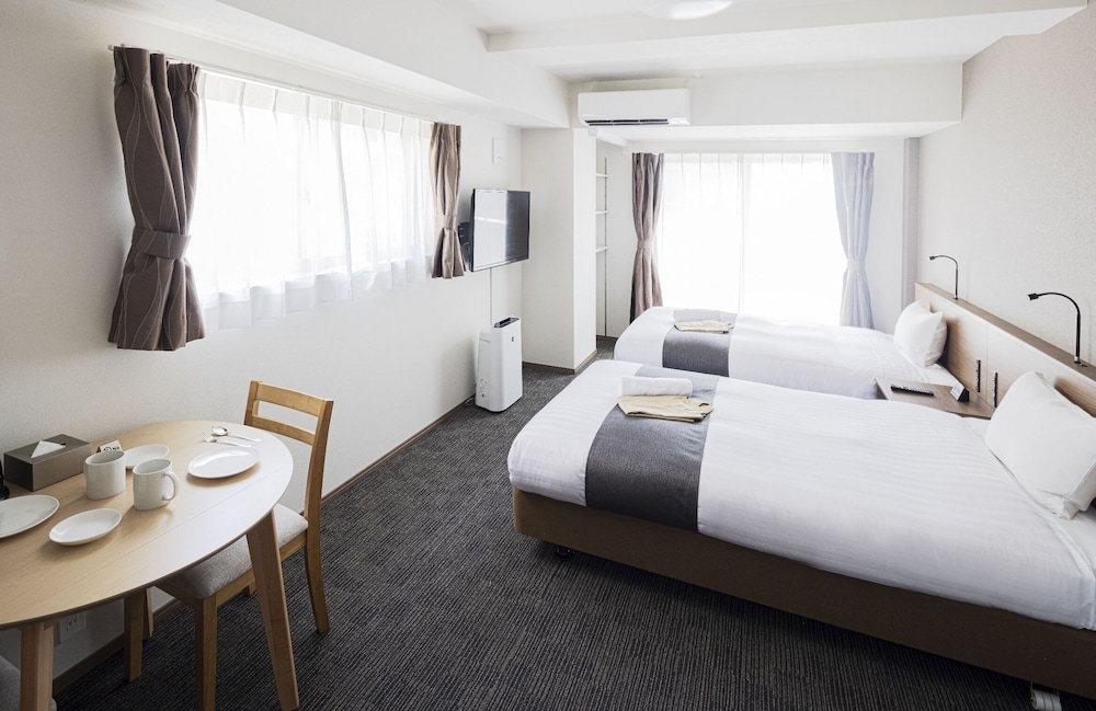 スタンダード ルーム ベッド (複数台) 客室6 | Coruscant Hotel 長崎駅 III