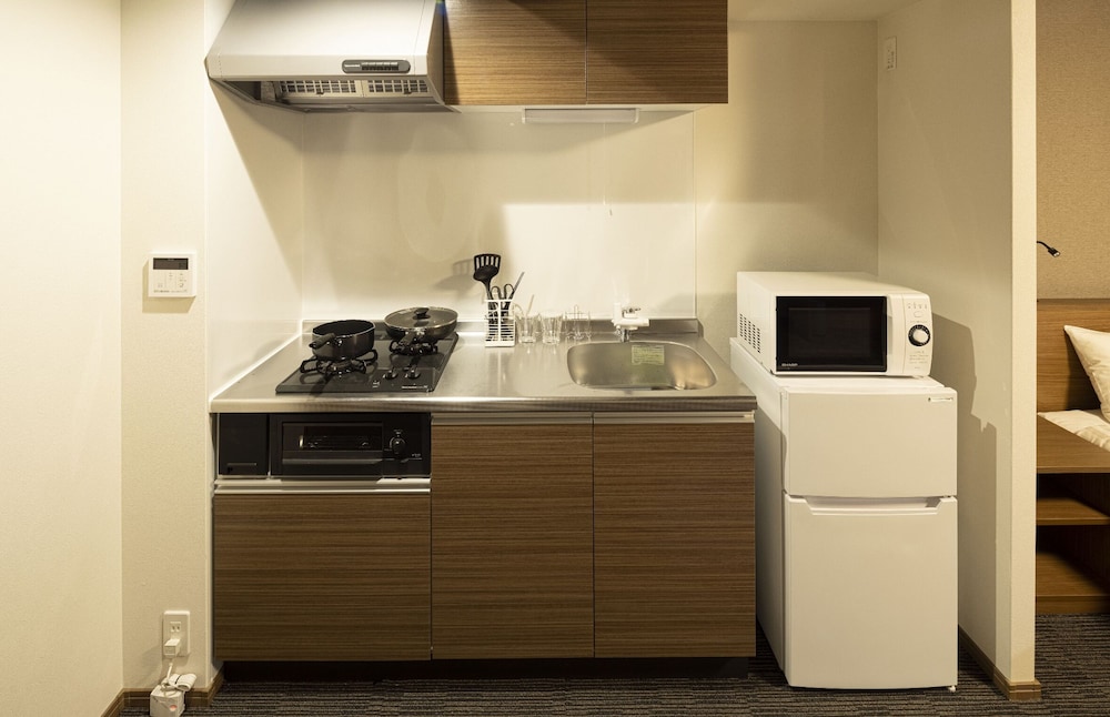 スーペリア ルーム ベッド (複数台) 専用キッチン0 | Coruscant Hotel 長崎駅 III